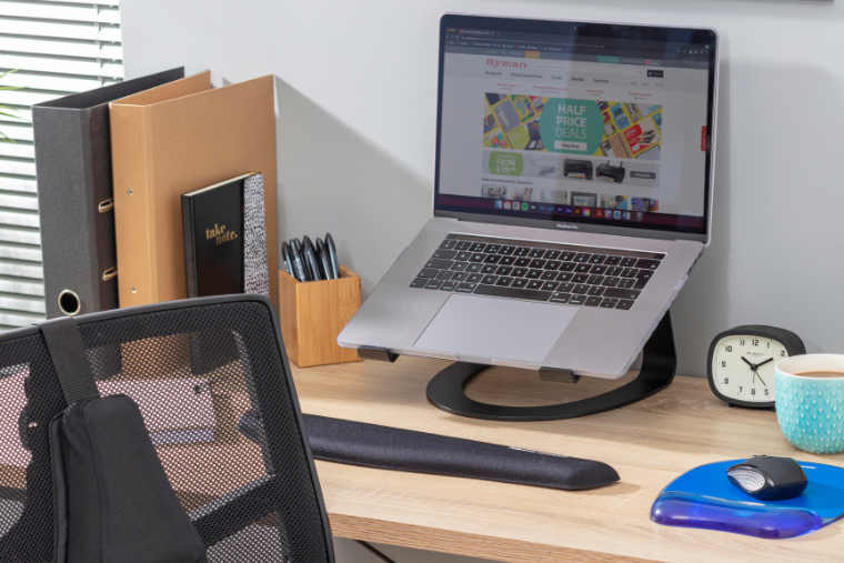 An ergonomic home office set up with an office chair, laptop stand, mouse and mouse mat.